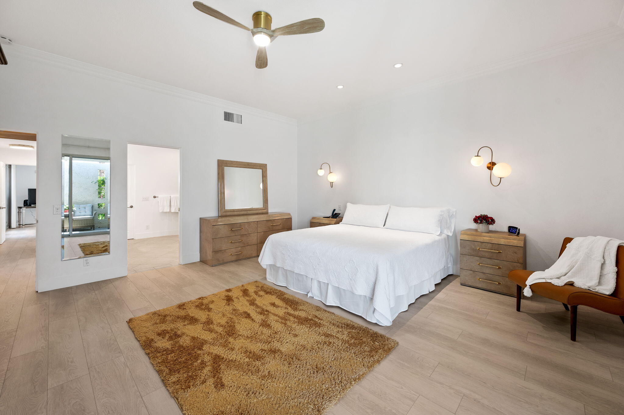 45835 Pawnee Road Indian Wells, CA 92210 - Photo 19 of 46 a spacious bedroom with a bed and glass walk in closet