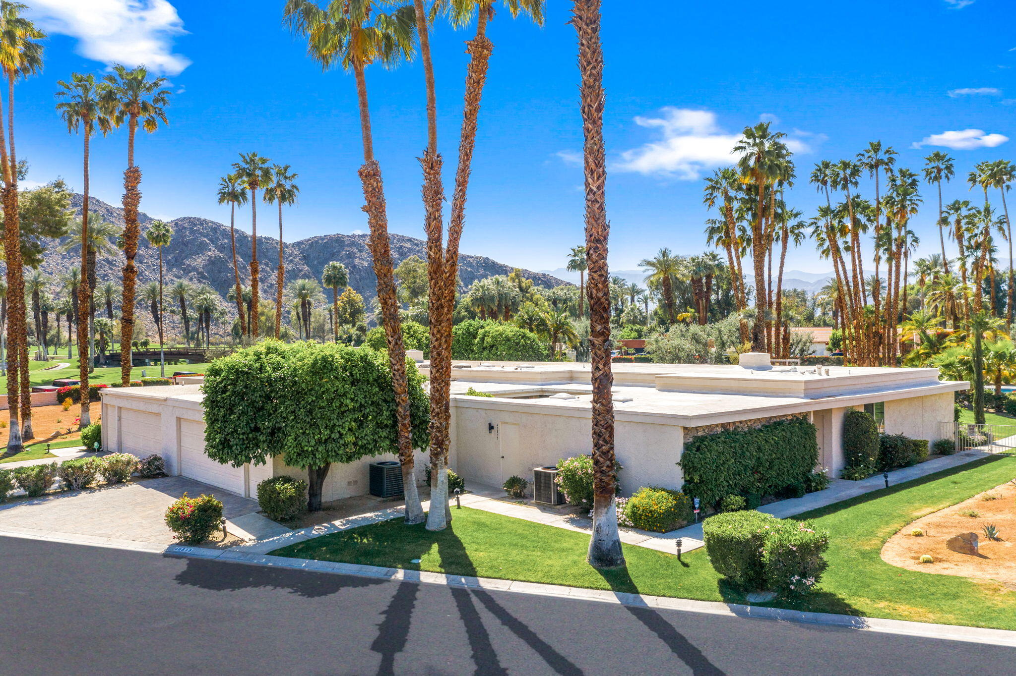 45835 Pawnee Road Indian Wells, CA 92210 - Photo 2 of 46 a view of a street with a building in the background