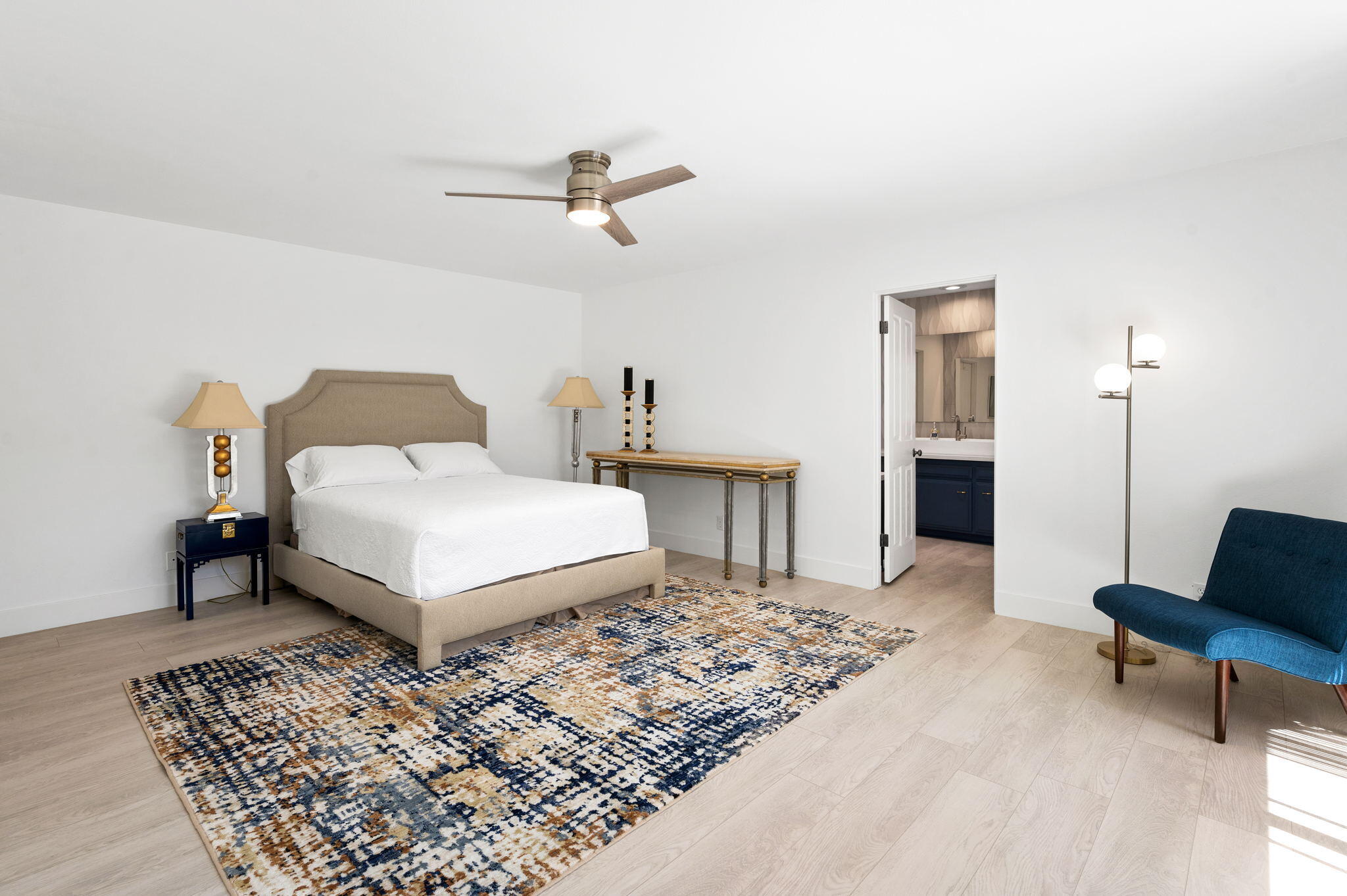 45835 Pawnee Road Indian Wells, CA 92210 - Photo 25 of 46 a spacious bedroom with a bed table and a couch