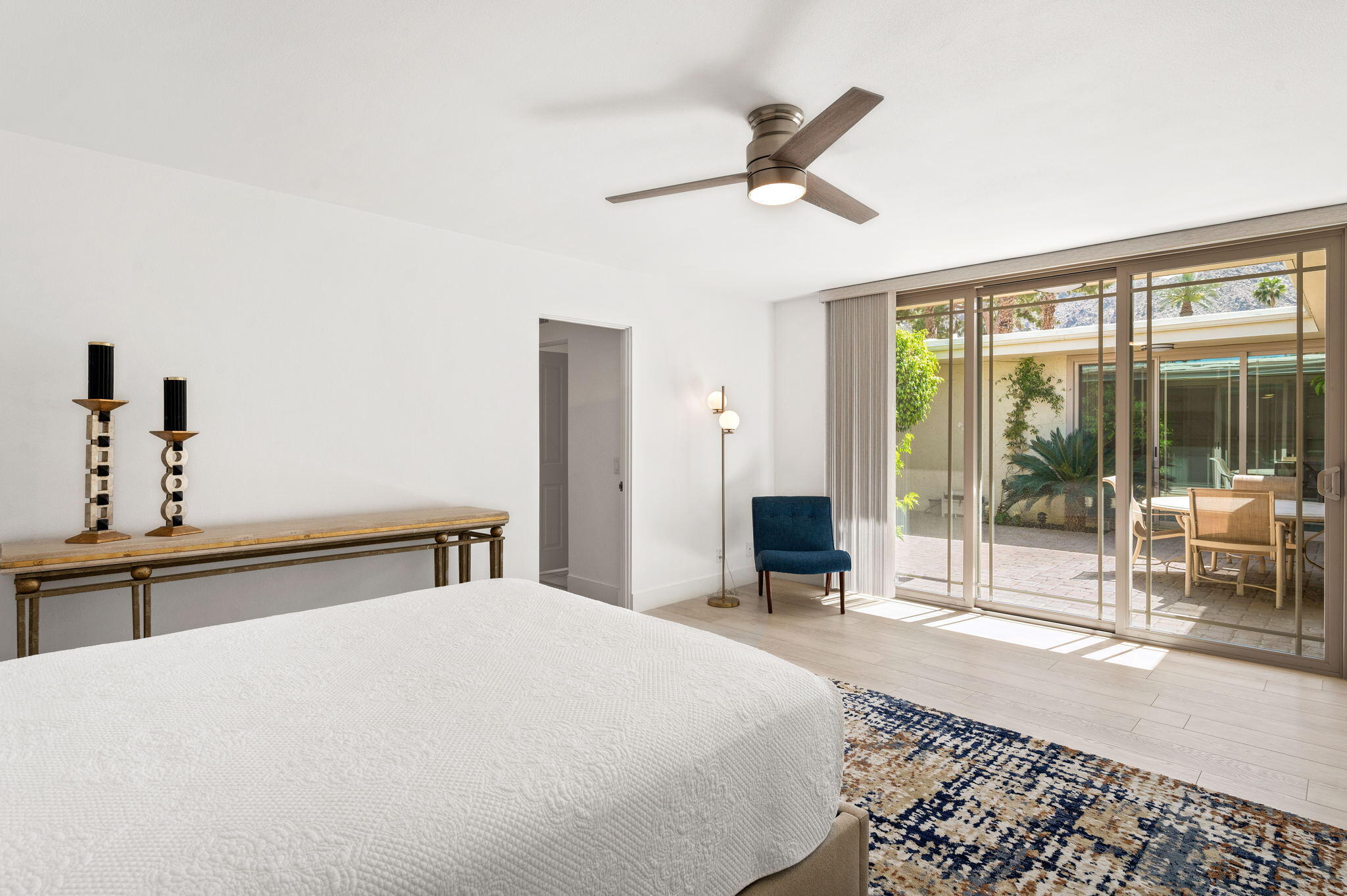 45835 Pawnee Road Indian Wells, CA 92210 - Photo 26 of 46 a bedroom with a large bed and a large window