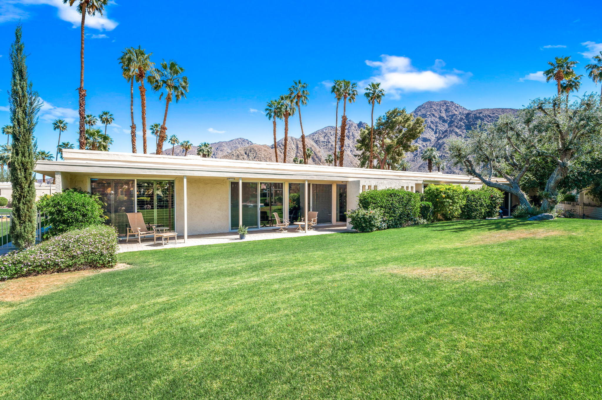 45835 Pawnee Road Indian Wells, CA 92210 - Photo 43 of 46 a front view of a house with a yard