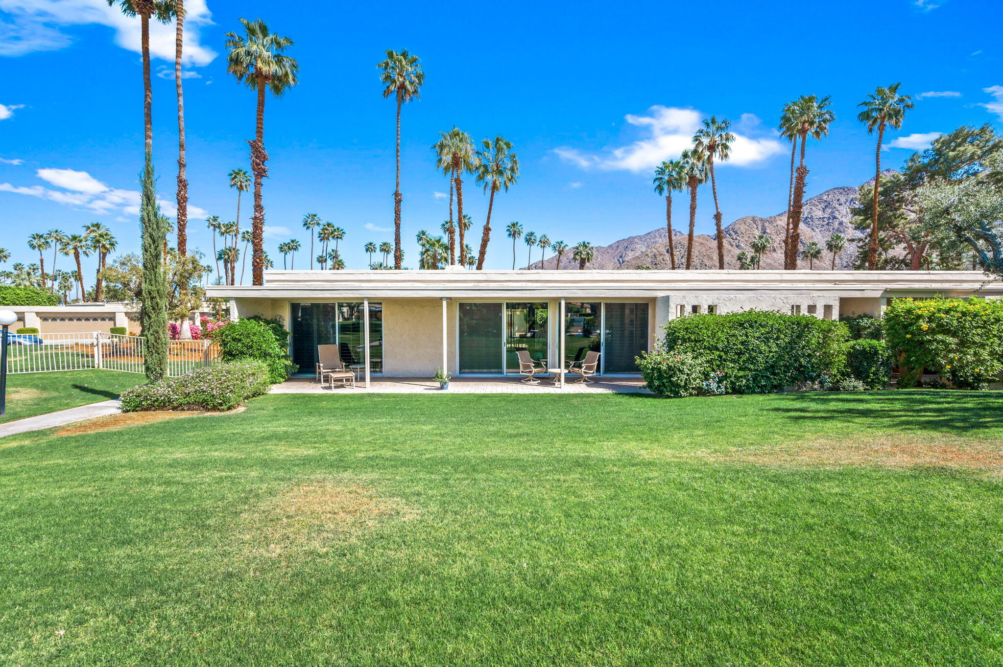 45835 Pawnee Road Indian Wells, CA 92210 - Photo 44 of 46 a view of a house with a yard and potted plants