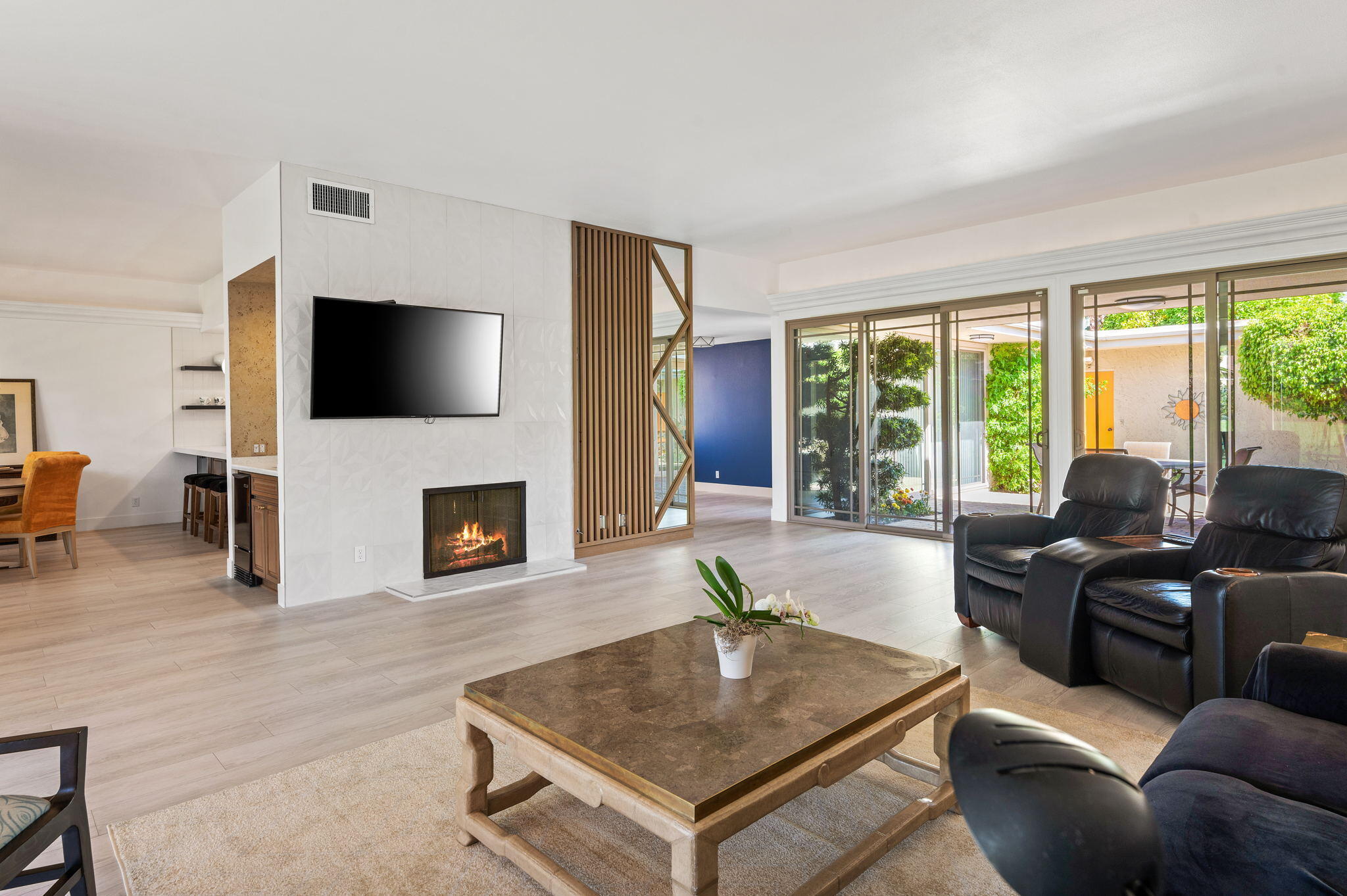 45835 Pawnee Road Indian Wells, CA 92210 - Photo 9 of 46 a living room with furniture a flat screen tv and a fireplace