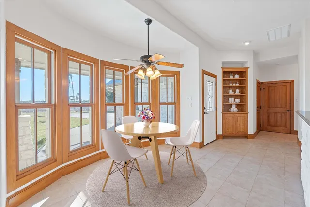 a dining room with furniture and window