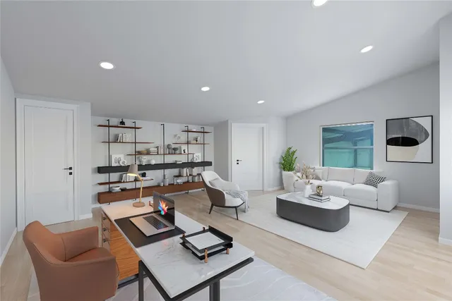 a living room with furniture and a table