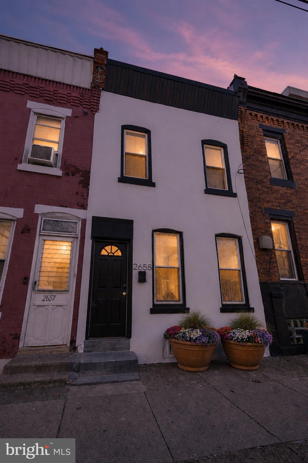 2655 Cedar Street Philadelphia, PA 19125 - Photo 2 of 22 a front view of a house with a yard