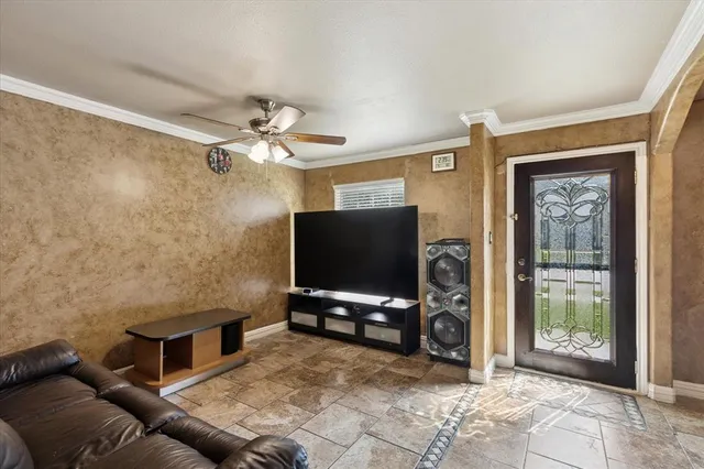 a living room with furniture and a flat screen tv