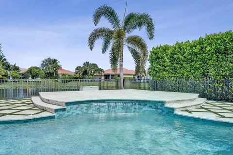 a outdoor sitting area with furniture and a potted plant