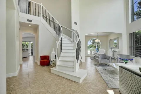 a view of a dining room with furniture wooden floor and chandelier