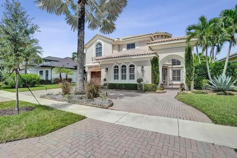 a view of house with outdoor space and swimming pool