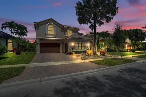 a swimming pool with outdoor seating and yard