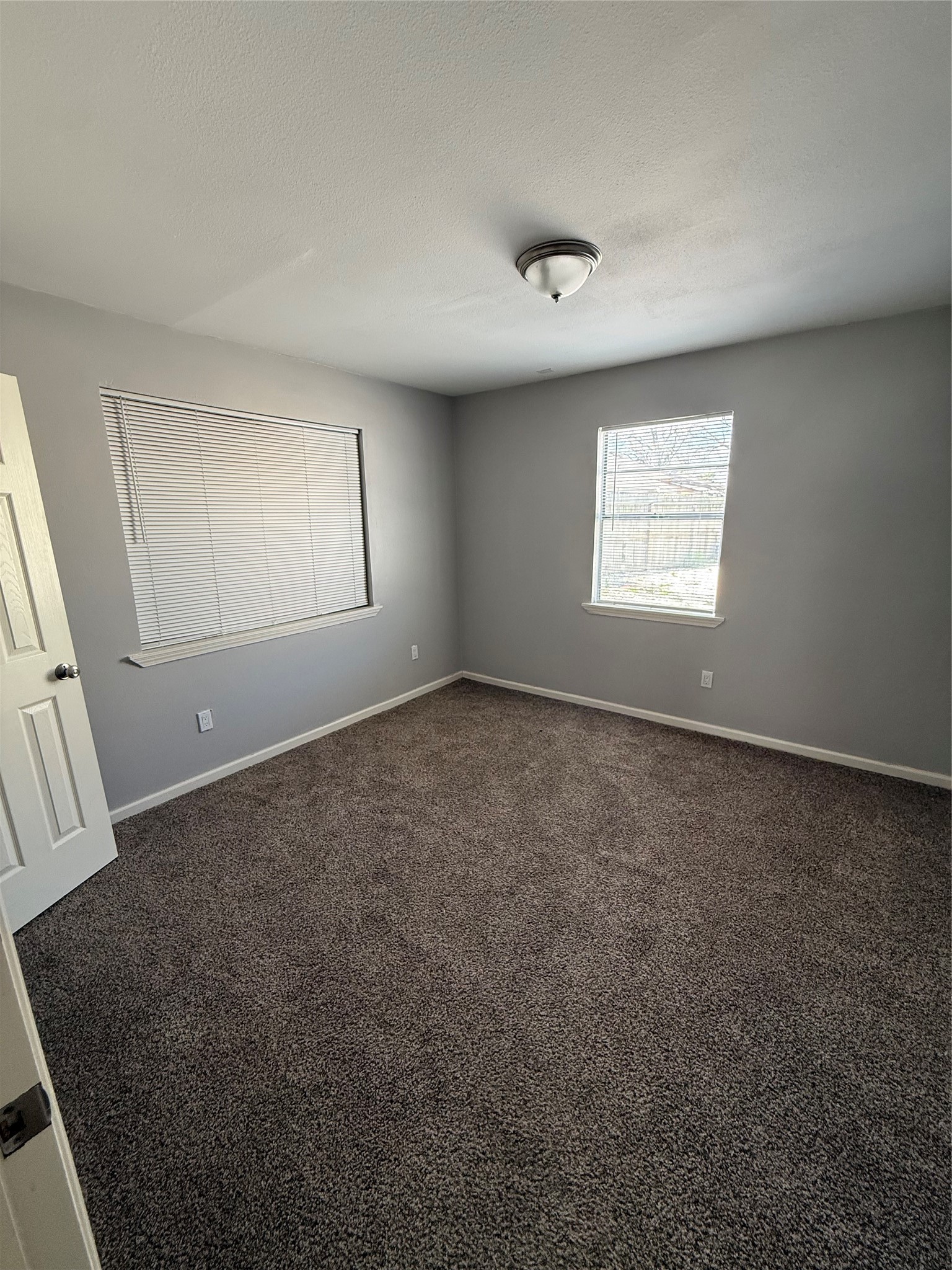 4315 Chapman Street Houston, TX 77009 - Photo 11 of 12 an empty room with windows