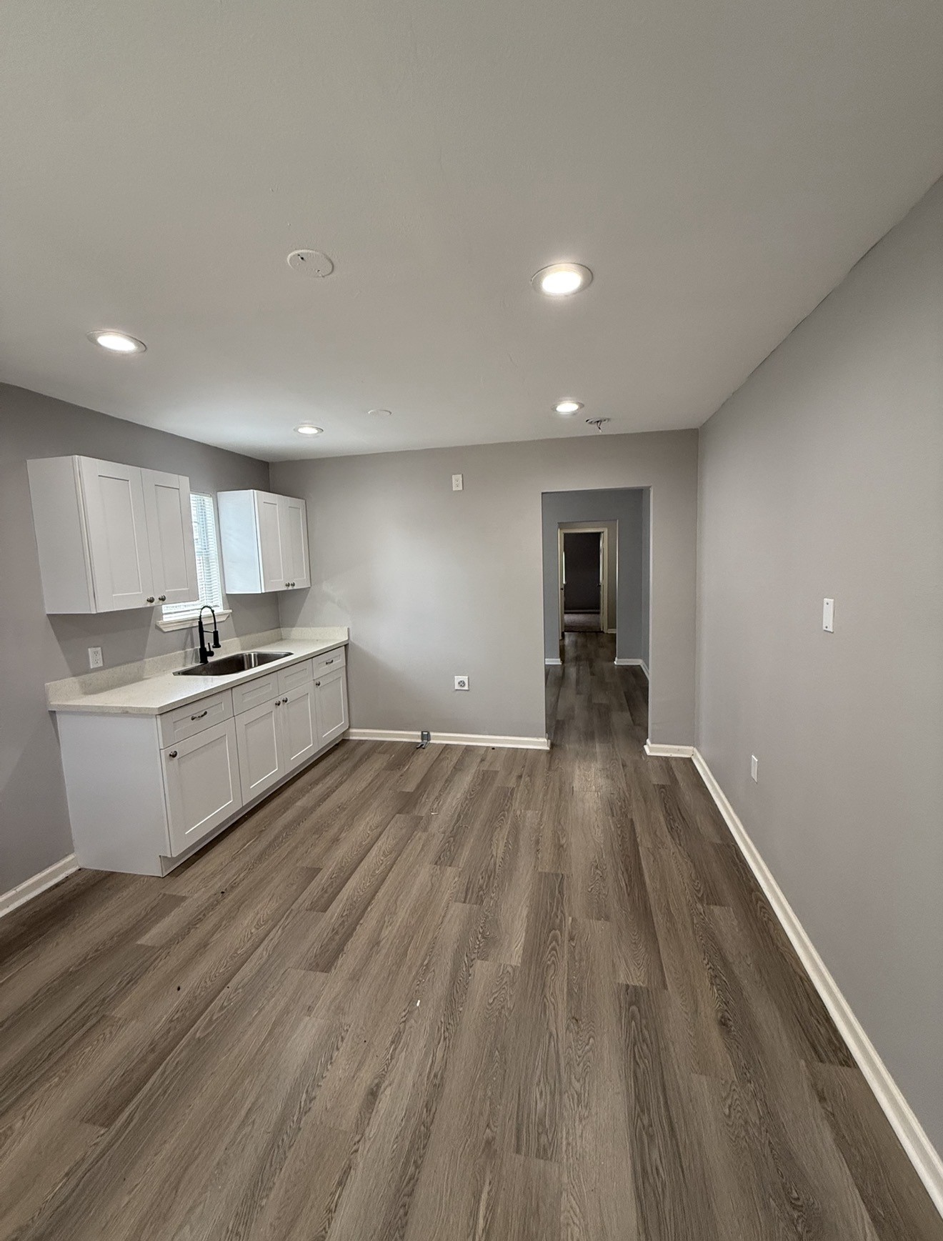 4315 Chapman Street Houston, TX 77009 - Photo 4 of 12 a view of kitchen with cabinets and wooden floor
