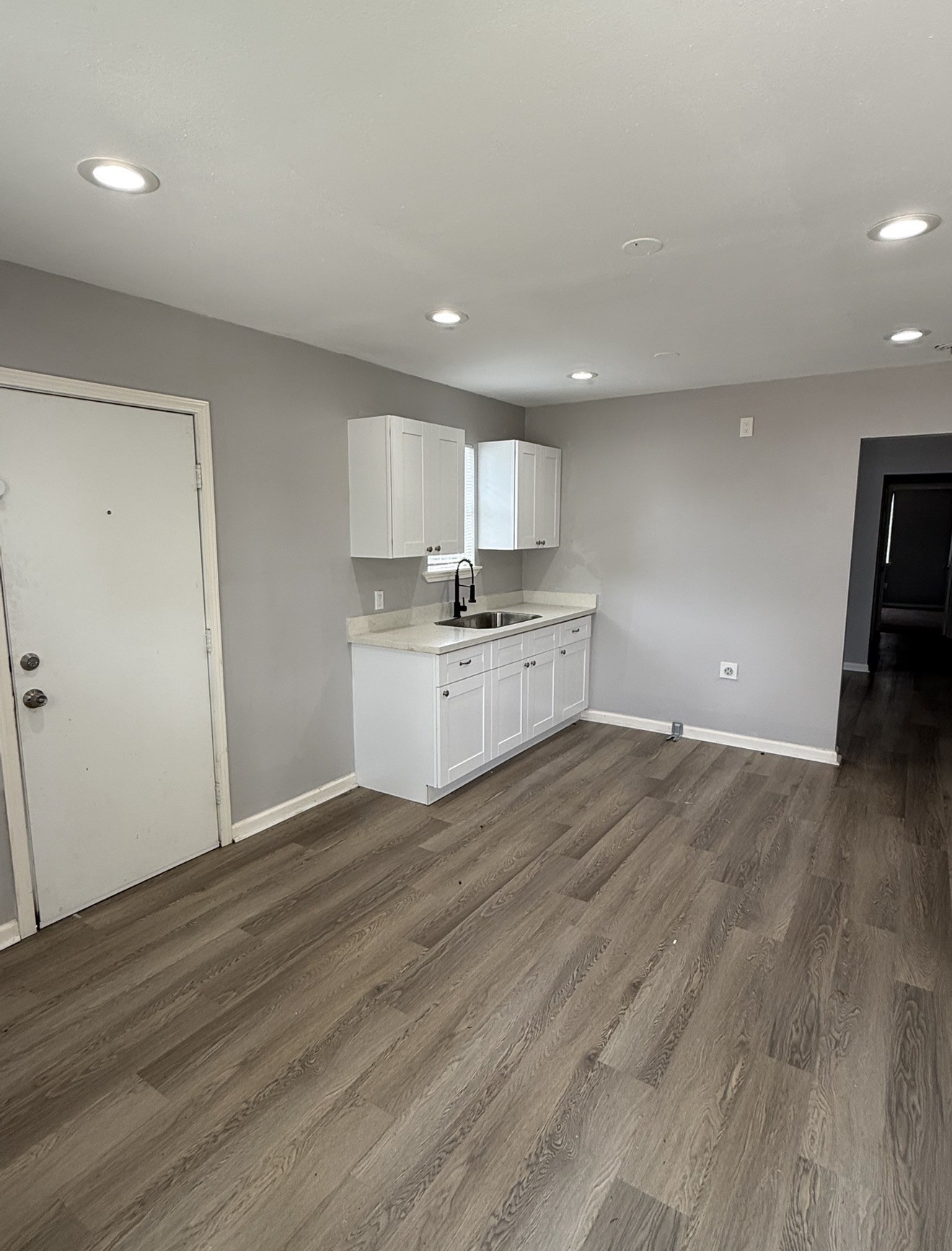 4315 Chapman Street Houston, TX 77009 - Photo 5 of 12 a kitchen with granite countertop a stove and a wooden floors