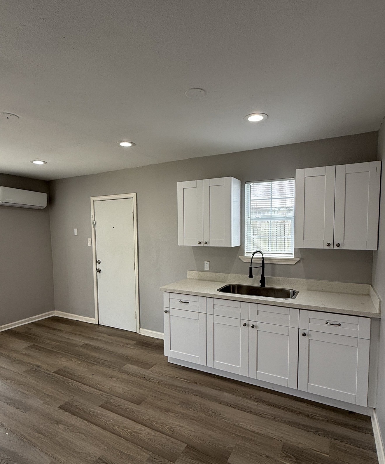 4315 Chapman Street Houston, TX 77009 - Photo 6 of 12 a kitchen with granite countertop a sink and cabinets