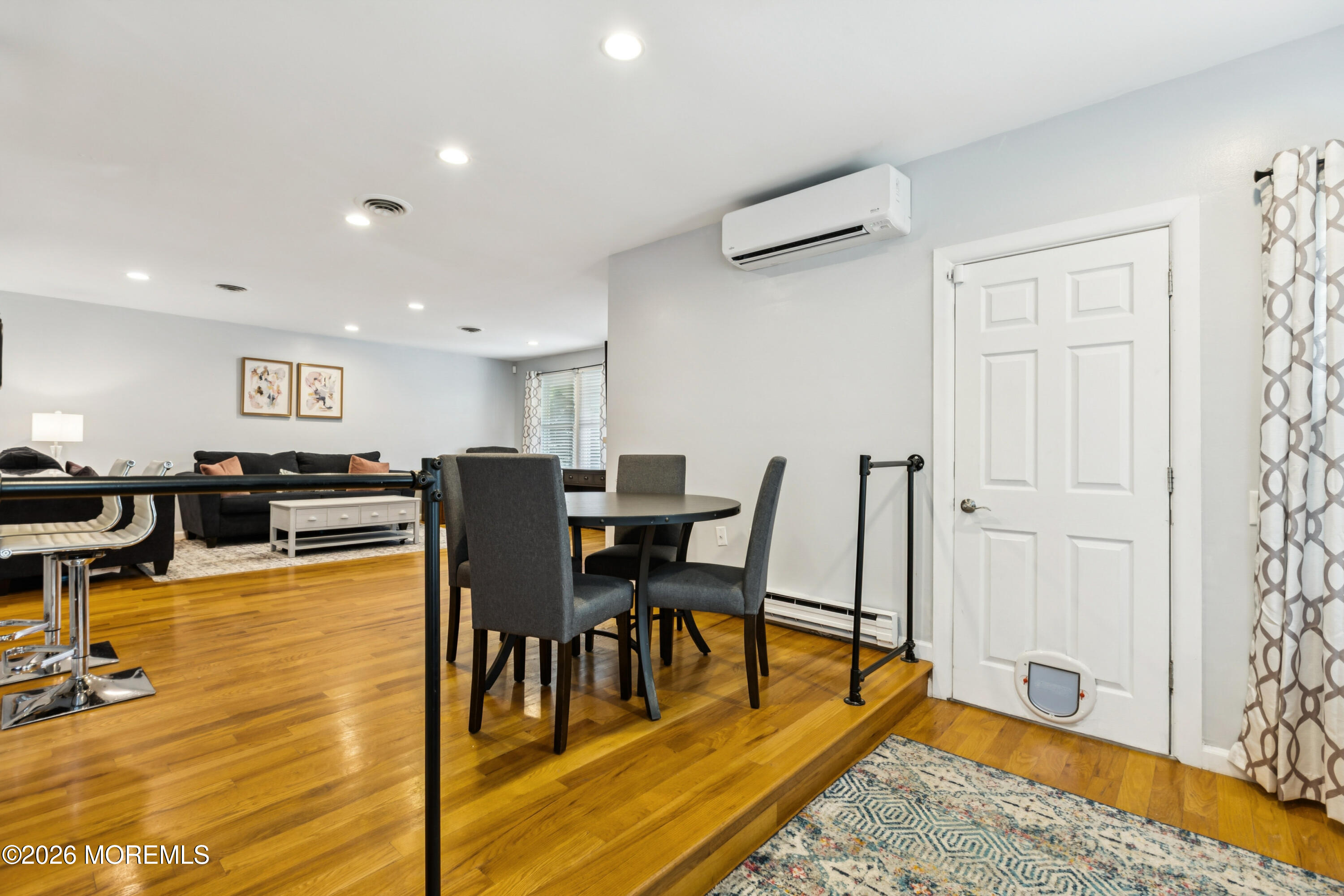 65 A Sunset Road, Unit 60 Whiting, NJ 08759 - Photo 11 of 24 a view of a dining room with furniture and wooden floor