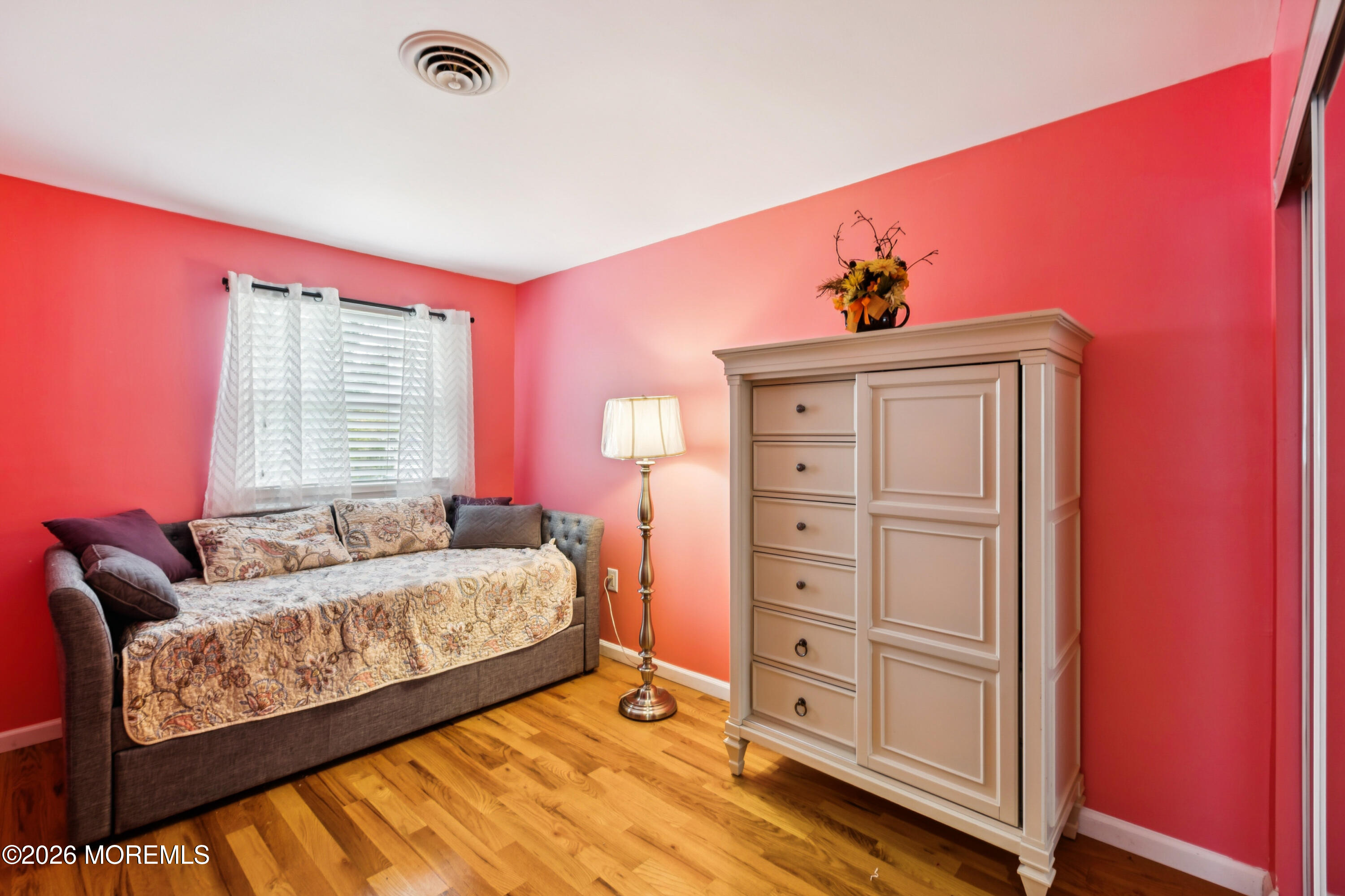 65 A Sunset Road, Unit 60 Whiting, NJ 08759 - Photo 14 of 24 a bedroom with a bed and a dresser