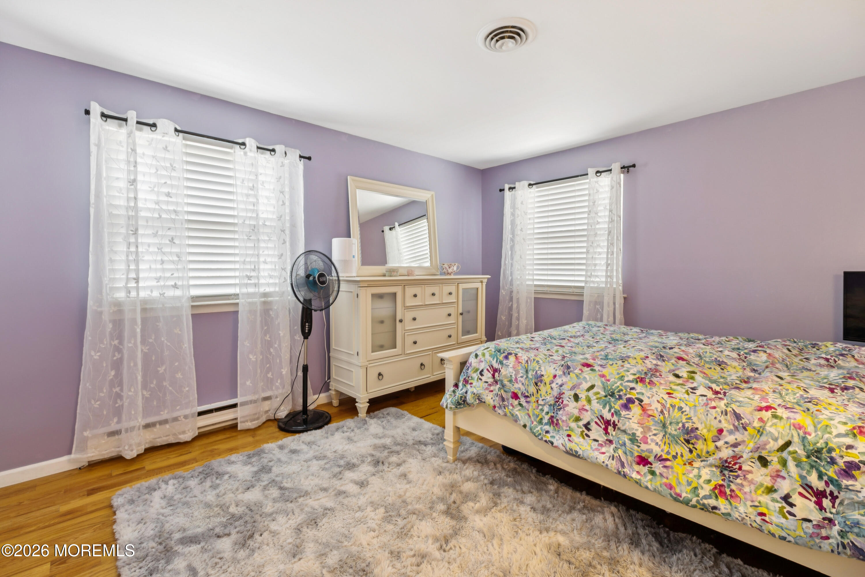 65 A Sunset Road, Unit 60 Whiting, NJ 08759 - Photo 16 of 24 a bedroom with a bed and a window
