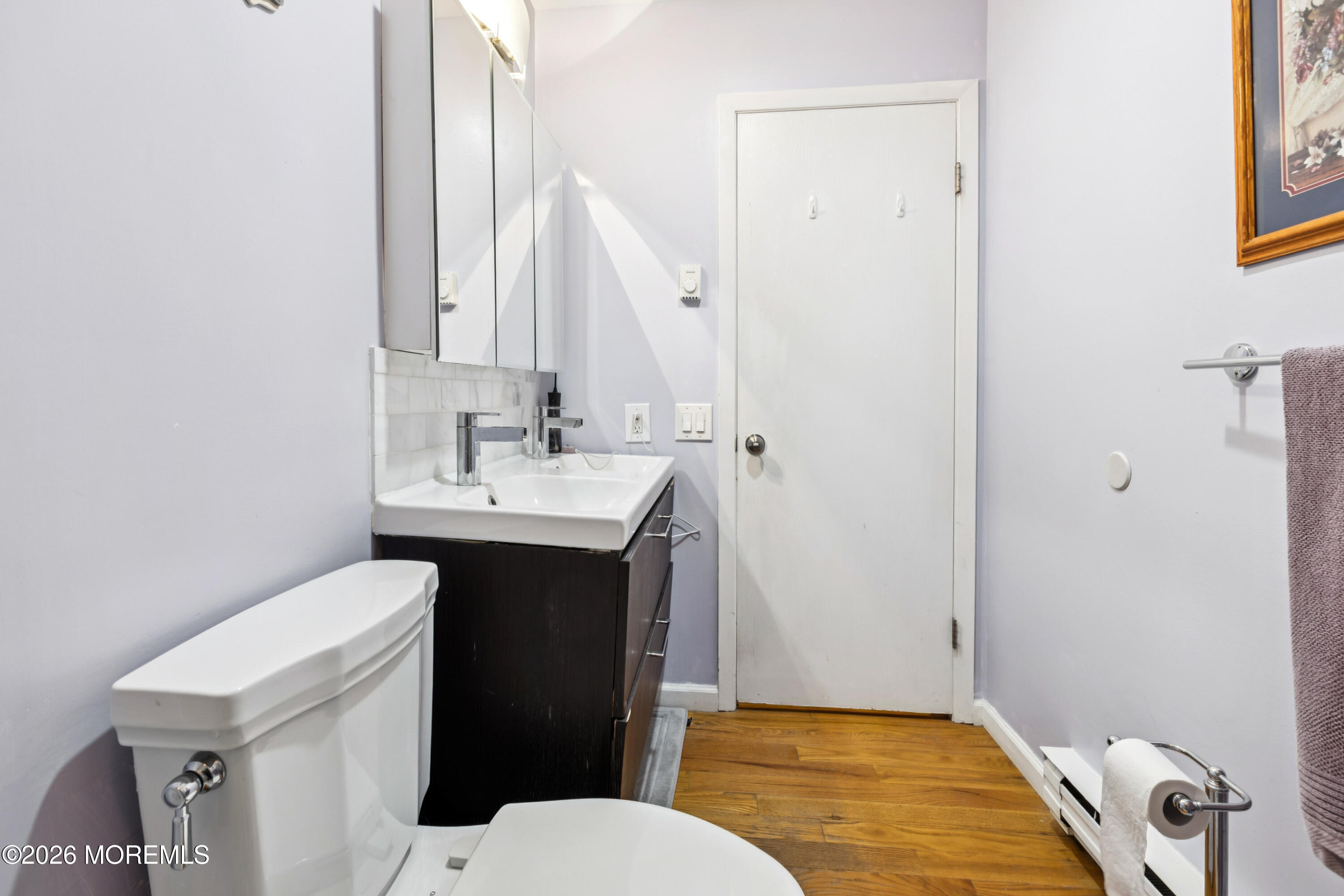 65 A Sunset Road, Unit 60 Whiting, NJ 08759 - Photo 19 of 24 a bathroom with a sink a toilet and shower