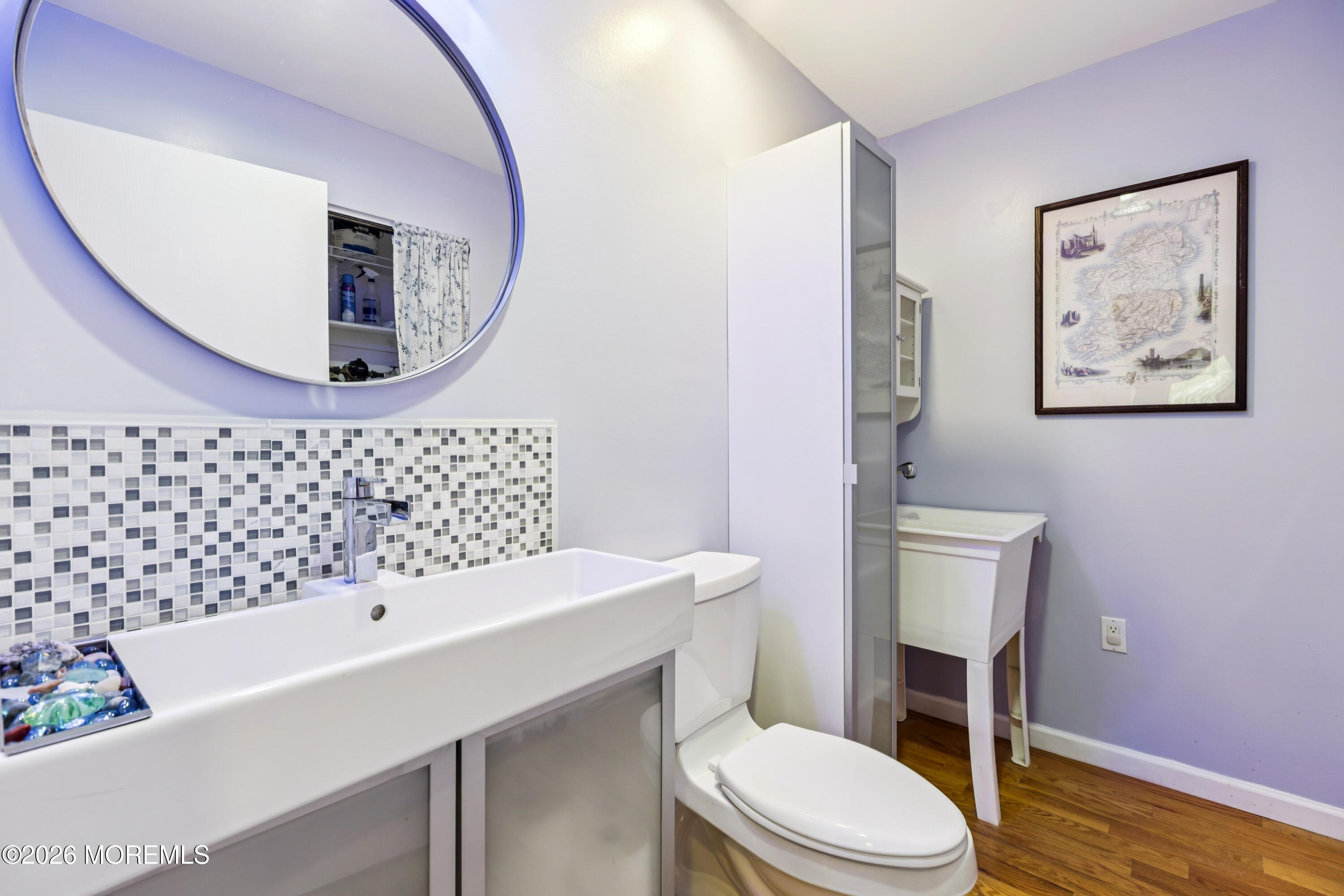 65 A Sunset Road, Unit 60 Whiting, NJ 08759 - Photo 20 of 24 a bathroom with a sink a mirror a toilet and a mirror