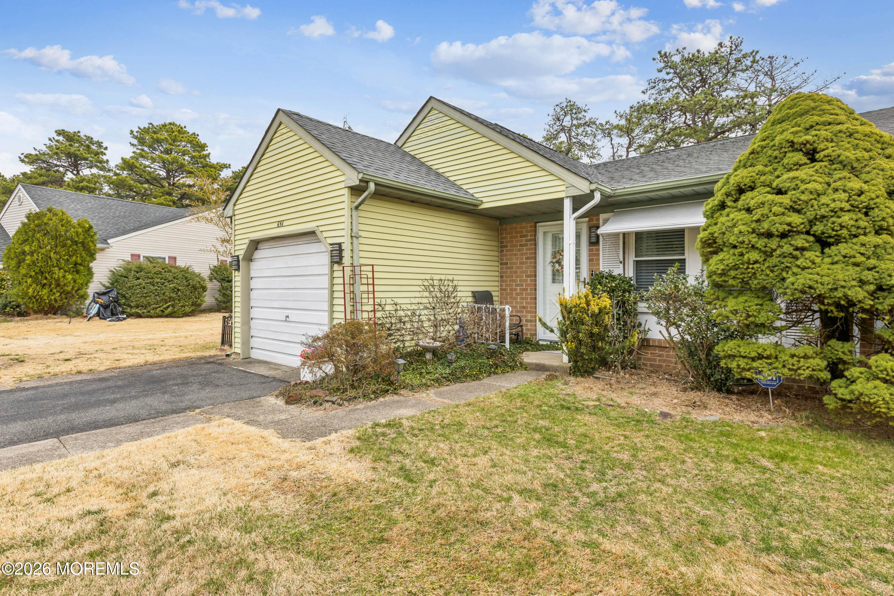65 A Sunset Road, Unit 60 Whiting, NJ 08759 - Photo 2 of 24 a view of a house with a yard and sitting area
