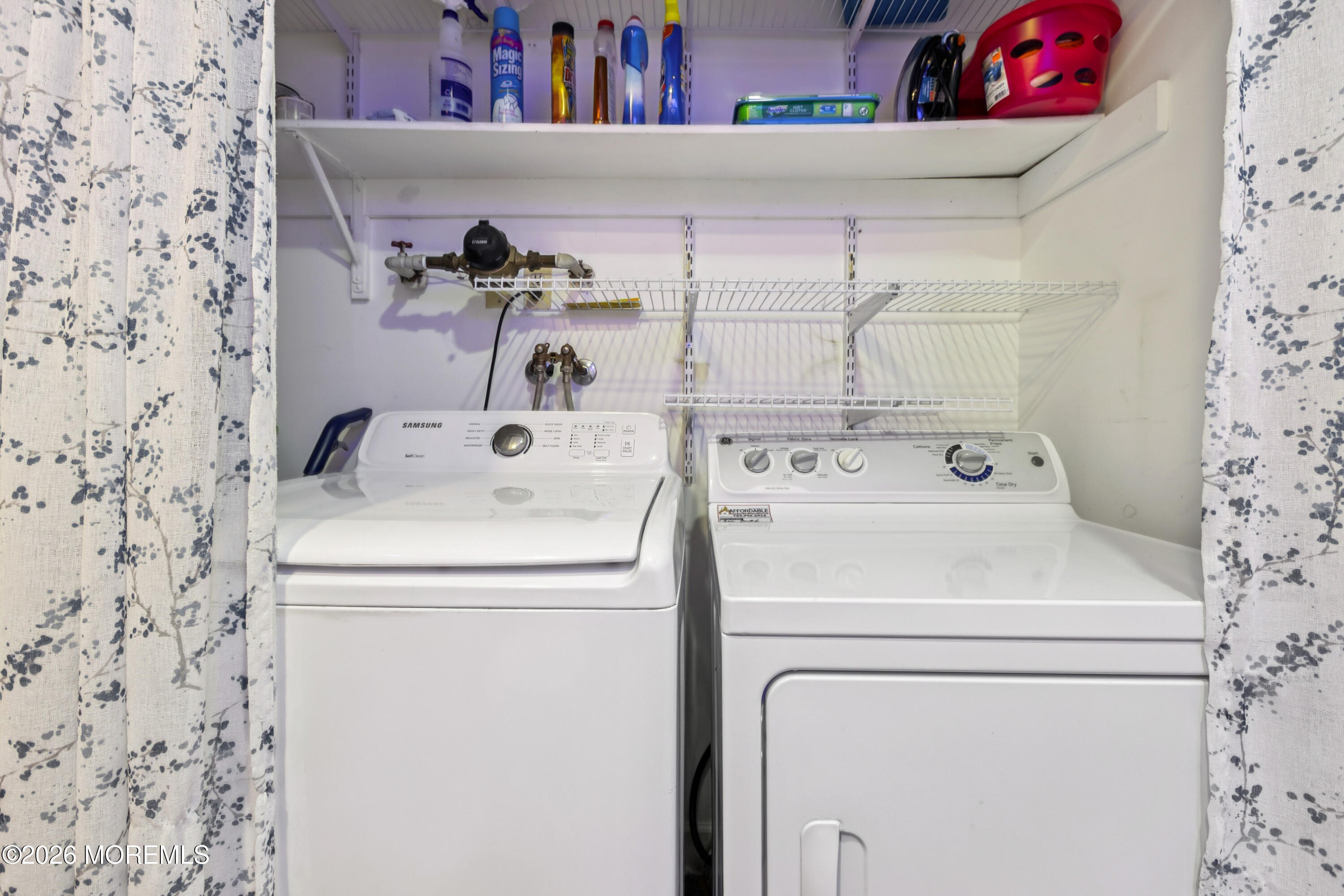 65 A Sunset Road, Unit 60 Whiting, NJ 08759 - Photo 21 of 24 a utility room with dryer and washer