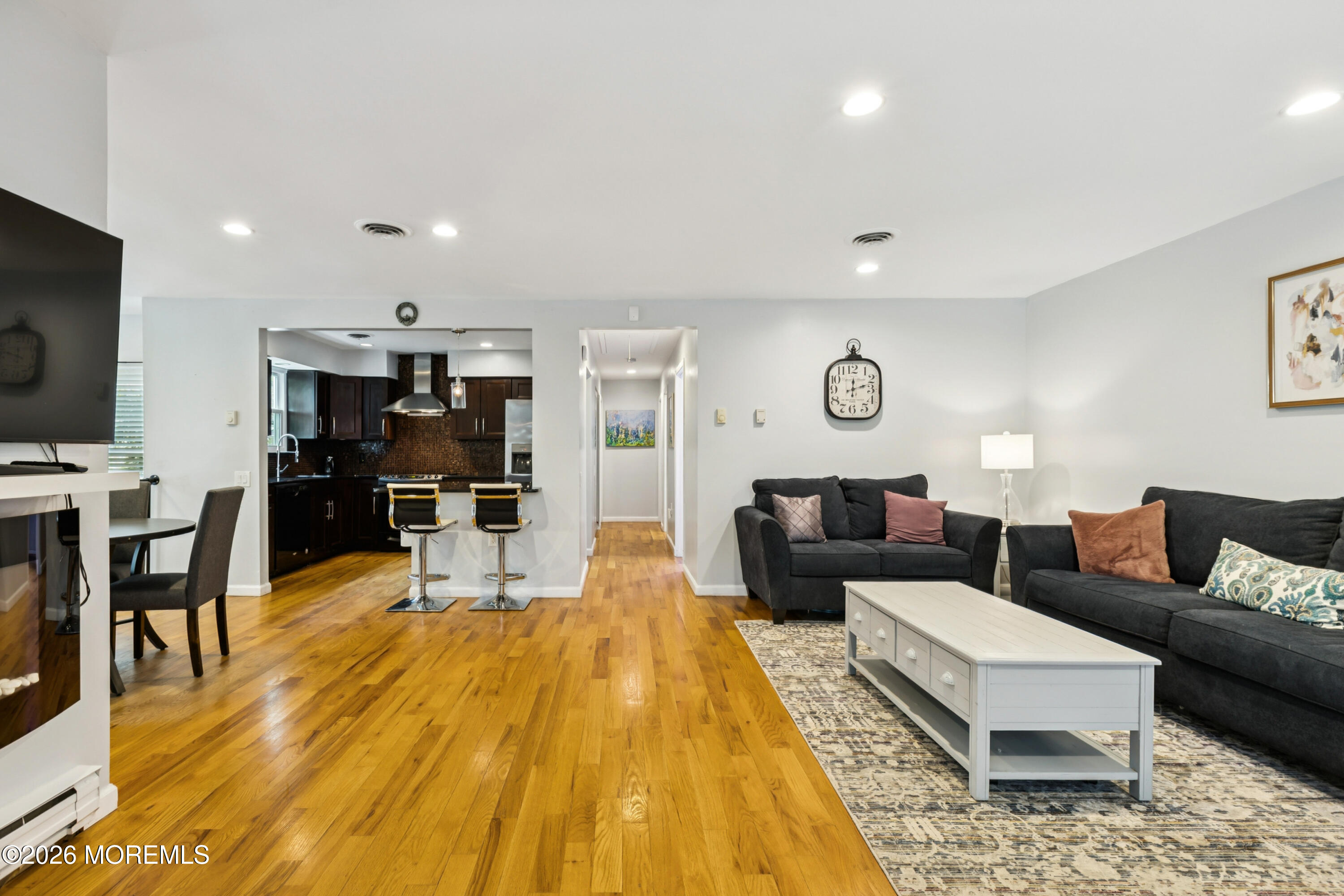 65 A Sunset Road, Unit 60 Whiting, NJ 08759 - Photo 4 of 24 a living room with furniture and a flat screen tv
