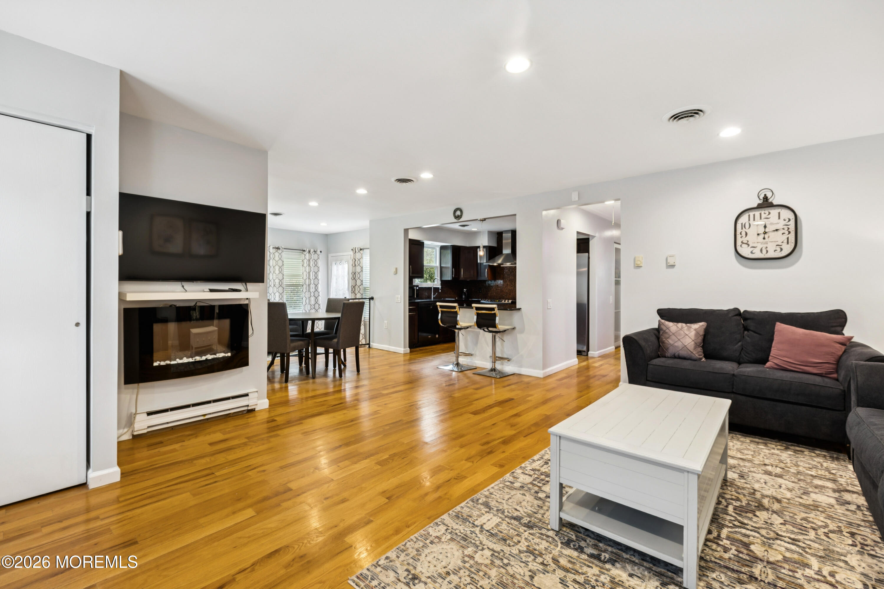 65 A Sunset Road, Unit 60 Whiting, NJ 08759 - Photo 5 of 24 a living room with furniture and a flat screen tv