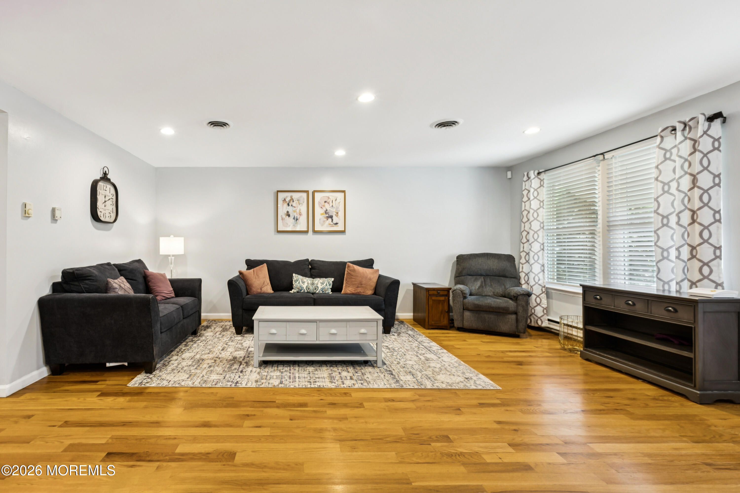 65 A Sunset Road, Unit 60 Whiting, NJ 08759 - Photo 7 of 24 a living room with furniture and a flat screen tv