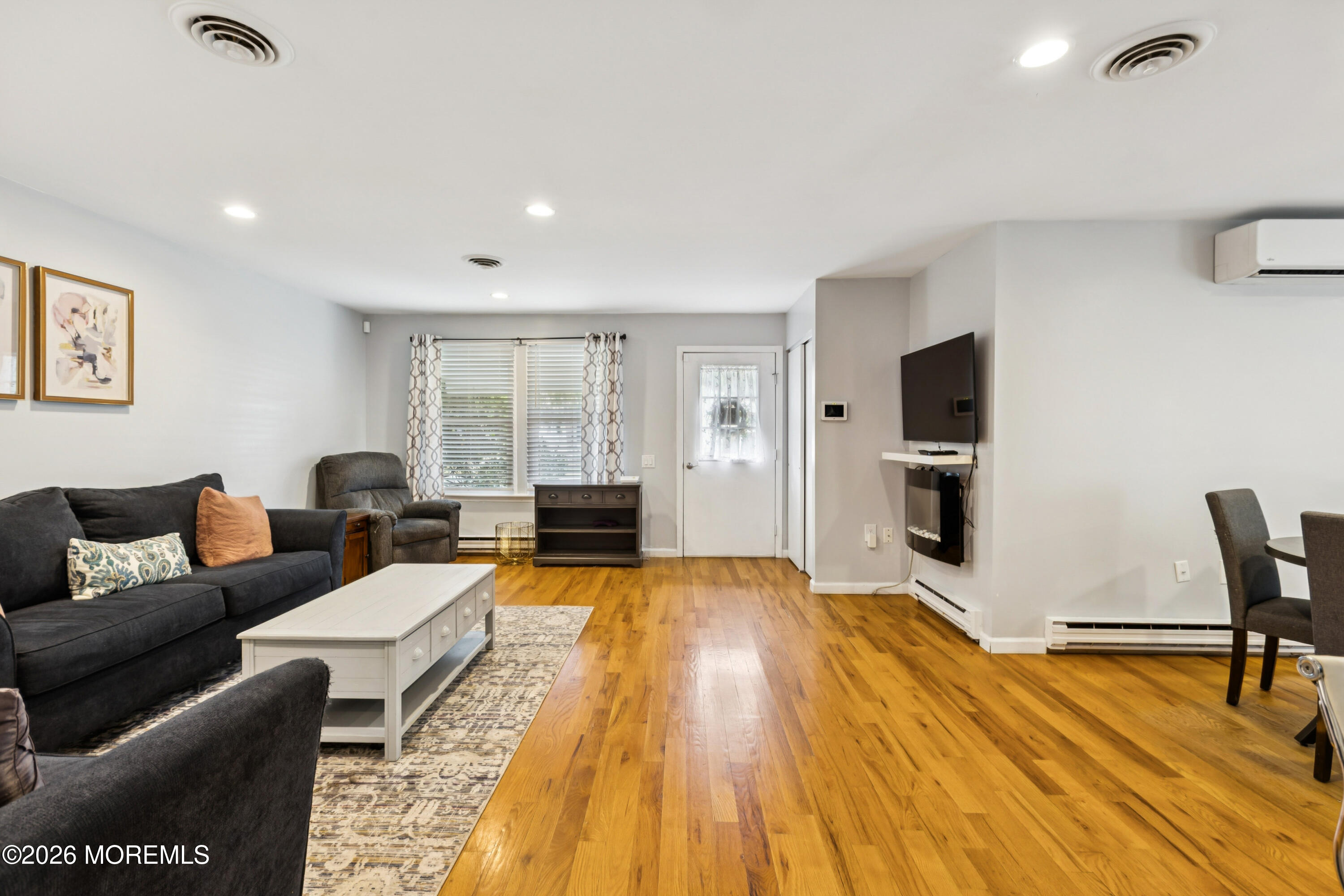 65 A Sunset Road, Unit 60 Whiting, NJ 08759 - Photo 8 of 24 a living room with furniture and a flat screen tv