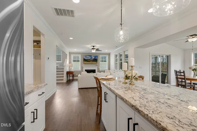 a view of living room with granite countertop furniture and fireplace