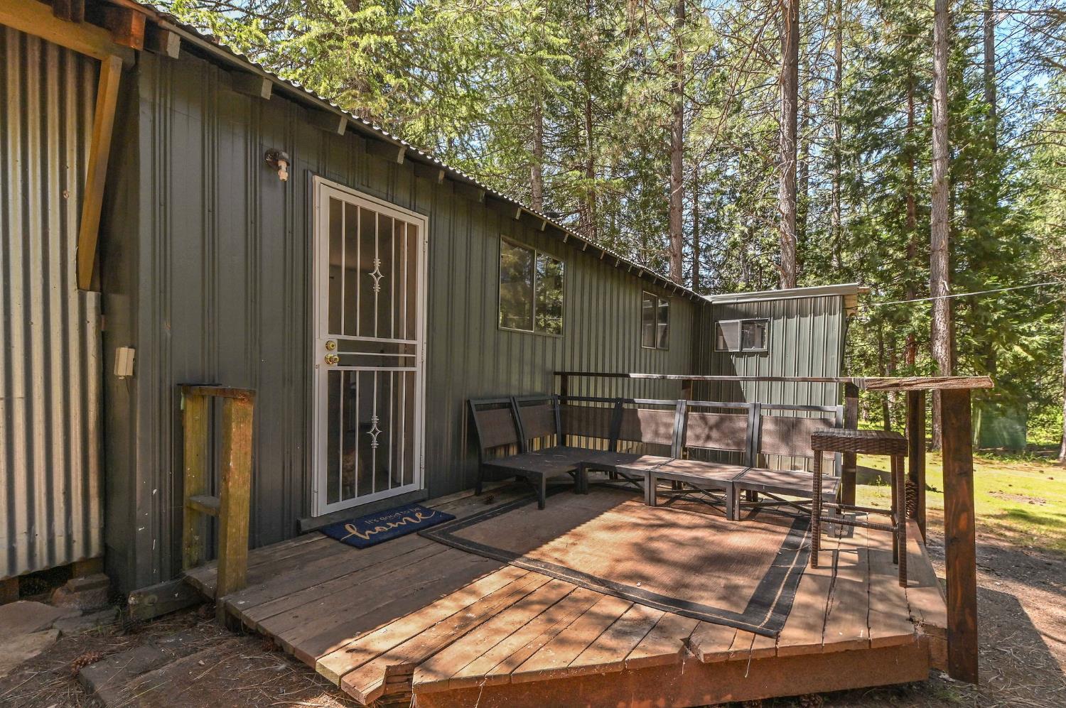 1216 Railroad Flat Road Mokelumne Hill, CA 95245 - Photo 1 of 1 a backyard of a house with barbeque oven