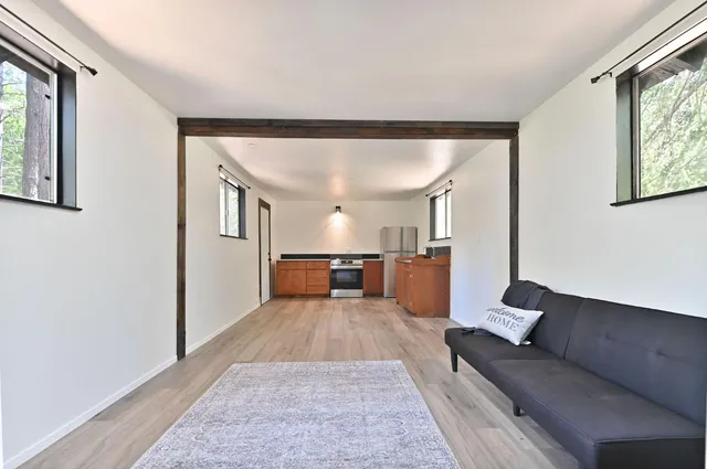 a living room with furniture and a rug