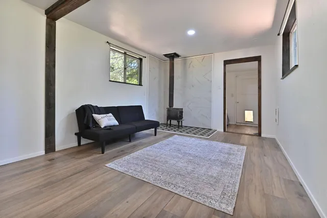 a living room with furniture and a rug
