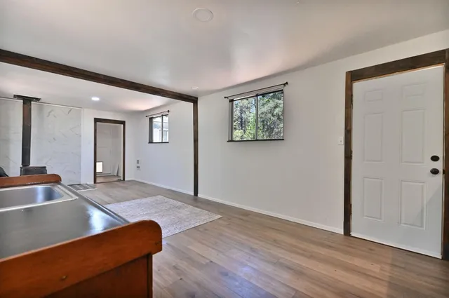 a view of a livingroom with furniture and wooden floor