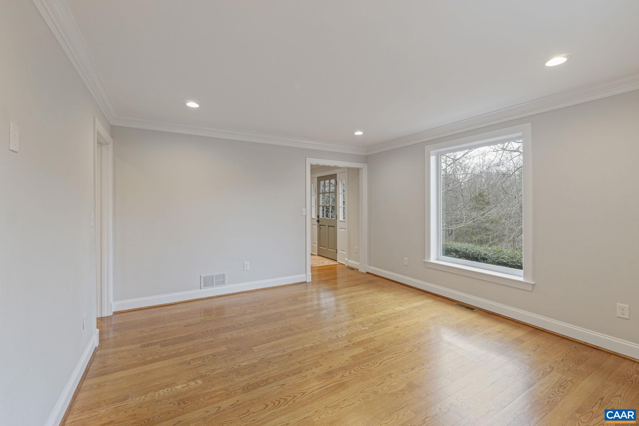 4053 Free Union Road Charlottesville, VA 22901 - Photo 12 of 67 an empty room with wooden floor and windows