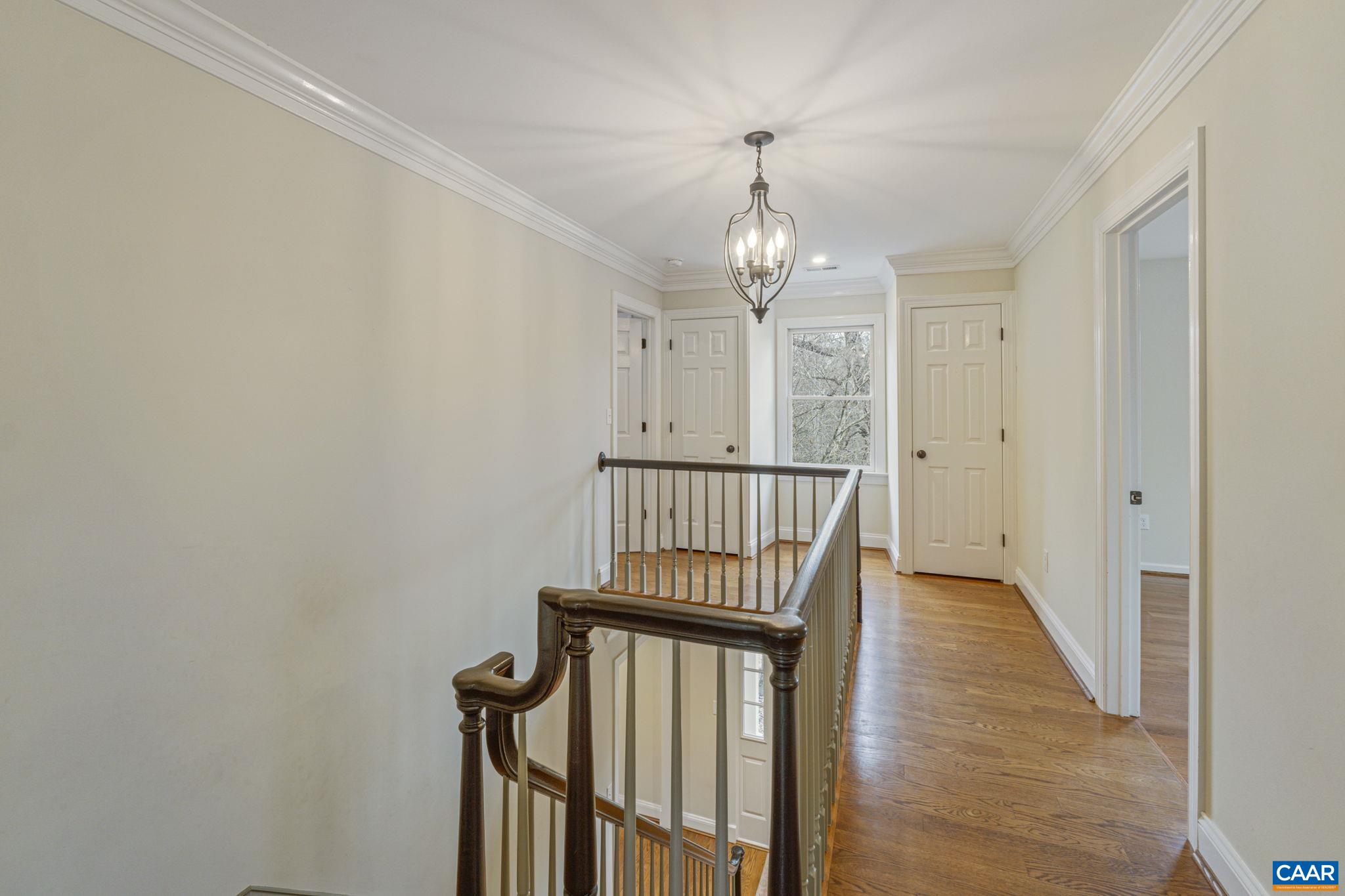 4053 Free Union Road Charlottesville, VA 22901 - Photo 35 of 67 a view of a hallway with wooden floor and staircase