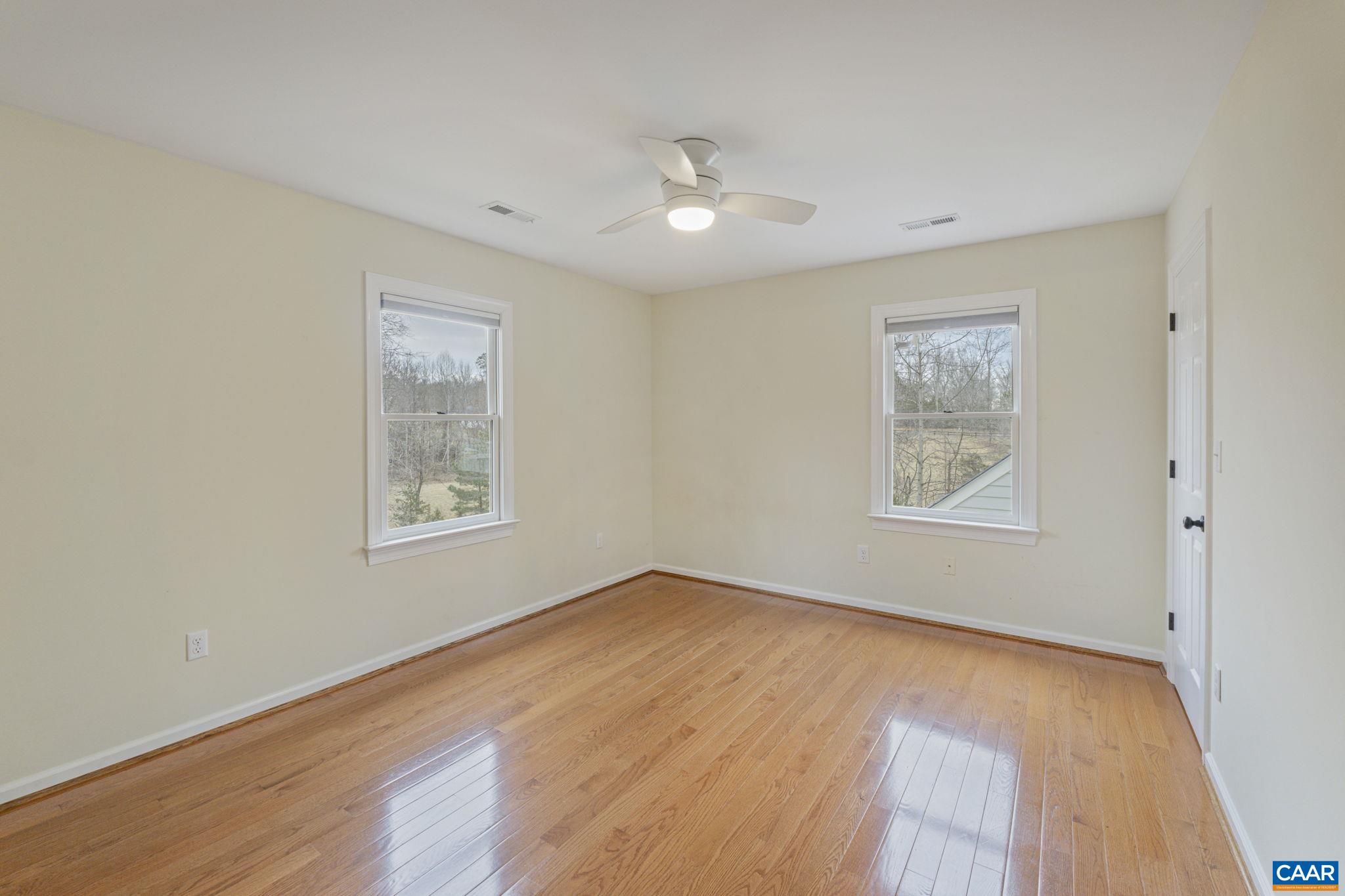 4053 Free Union Road Charlottesville, VA 22901 - Photo 38 of 67 a view of an empty room with a window and wooden floor