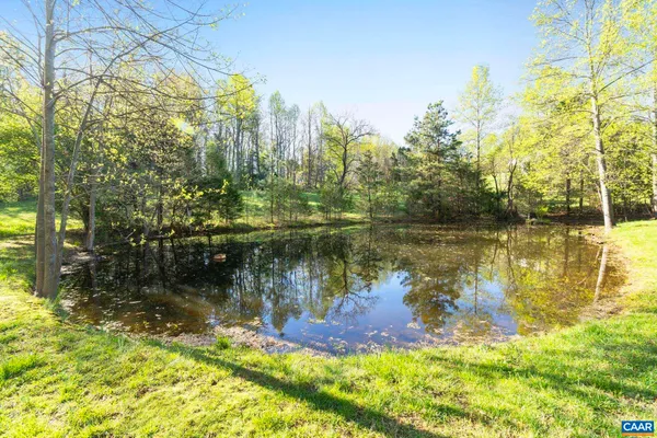 a view of a lake with a building in the background