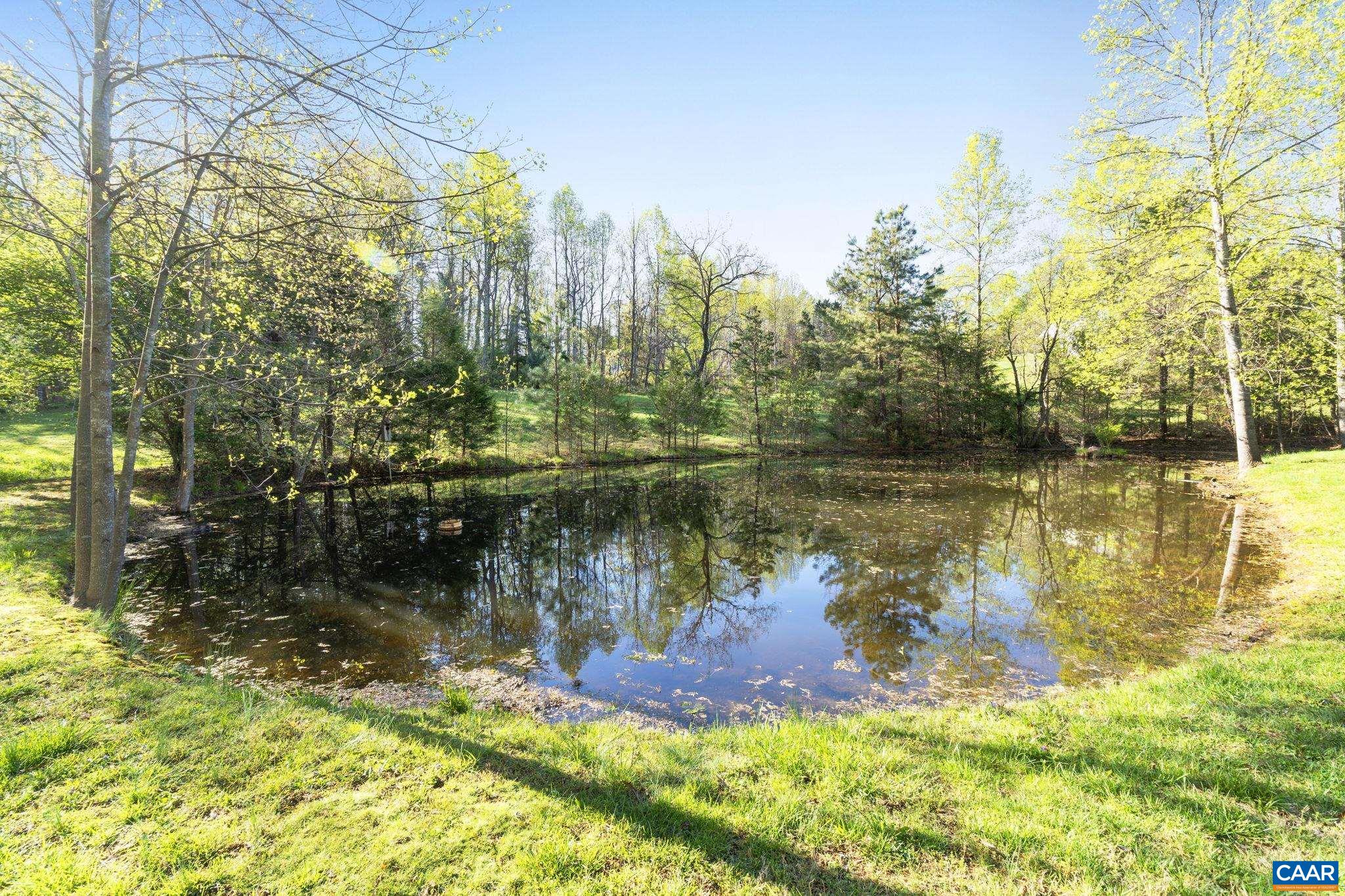 4053 Free Union Road Charlottesville, VA 22901 - Photo 5 of 67 a view of a lake with a building in the background
