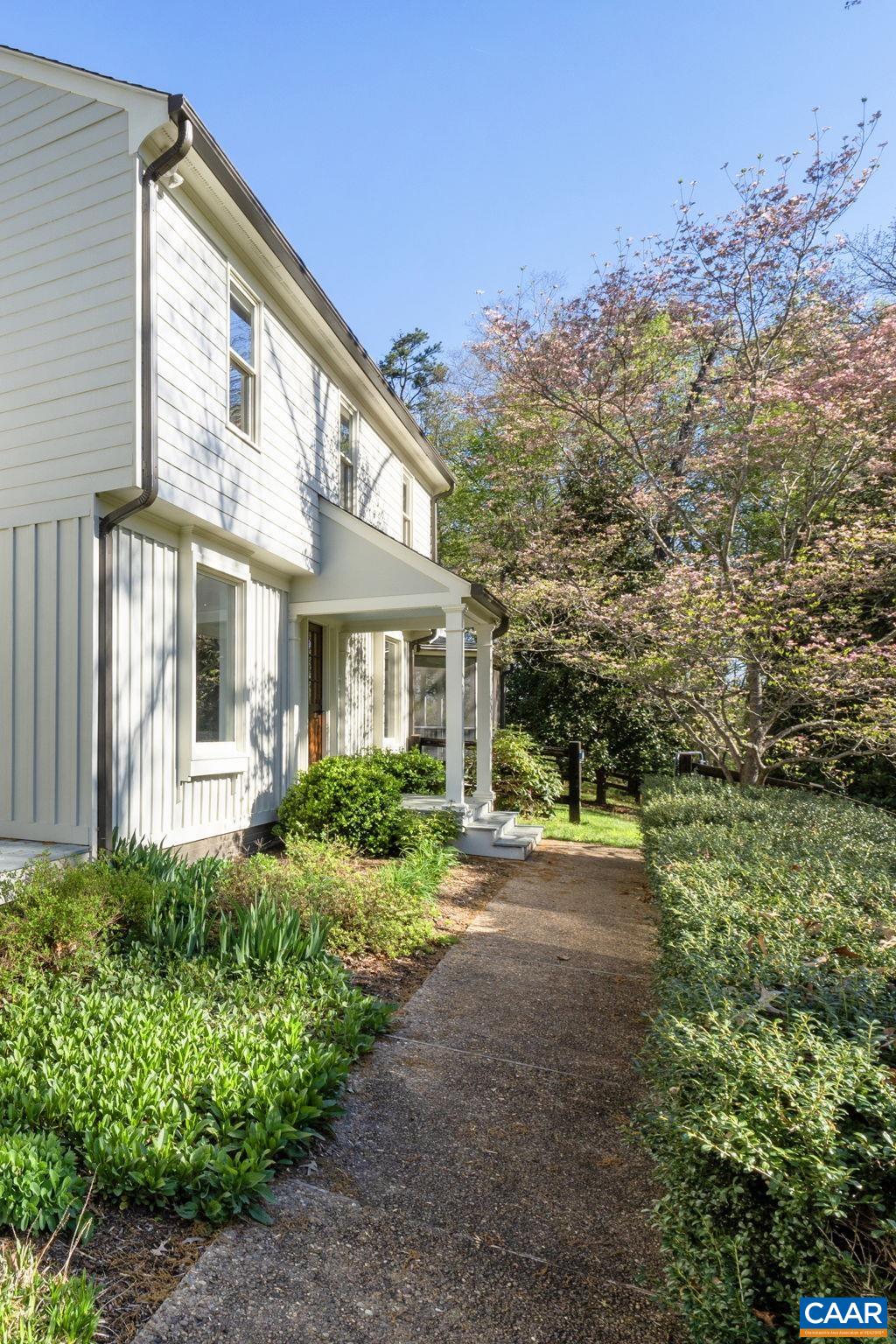 4053 Free Union Road Charlottesville, VA 22901 - Photo 57 of 67 a front view of a house with a yard and potted plants