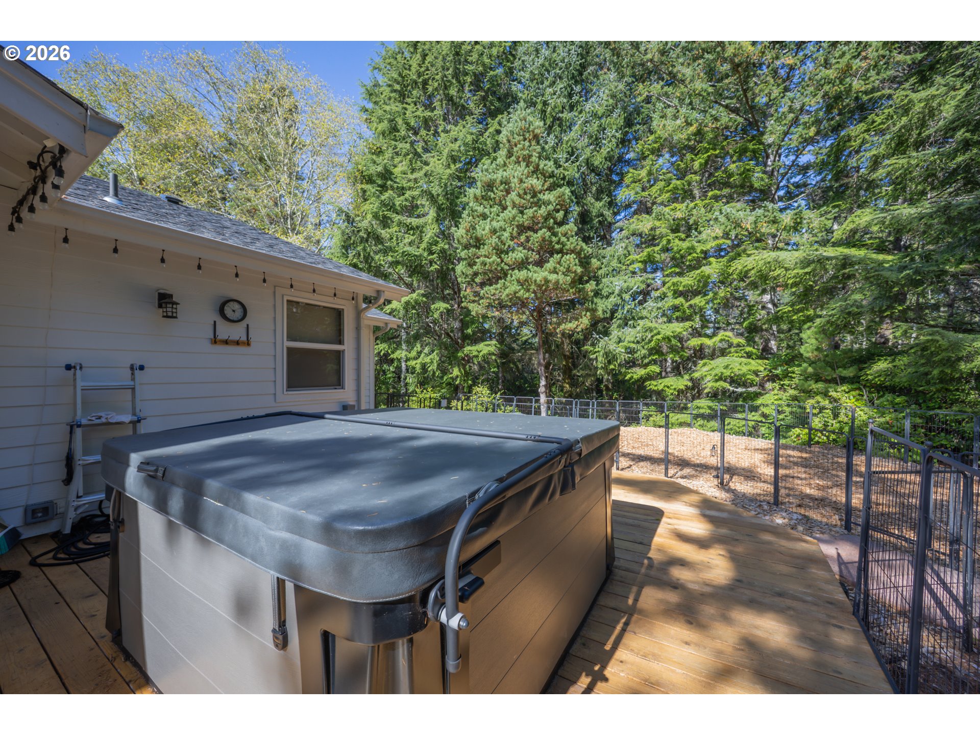 2193 13th Street Florence, OR 97439 - Photo 48 of 48 a view of a wooden floor and a table in the patio