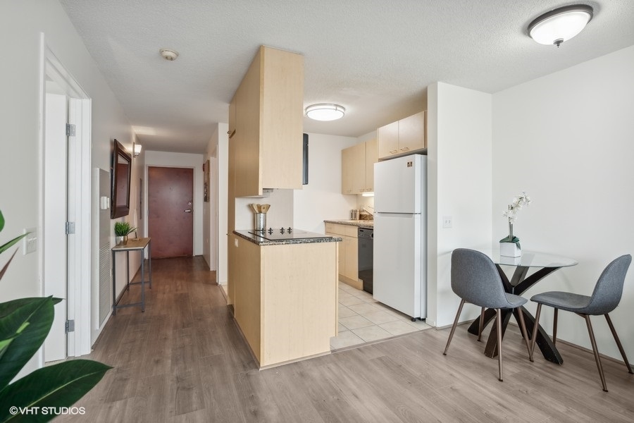 800 Elgin Road, Unit 1304 Evanston, IL 60201 - Photo 8 of 18 a view of kitchen with furniture and wooden floor
