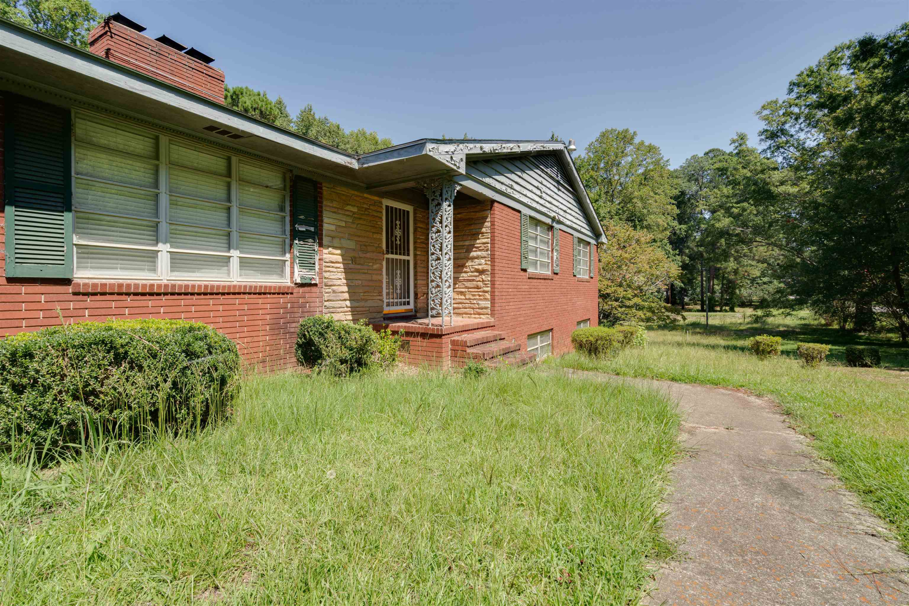 7676 Webbs Mill Road Spring Hope, NC 27882 - Photo 2 of 10 a front view of a house with a yard