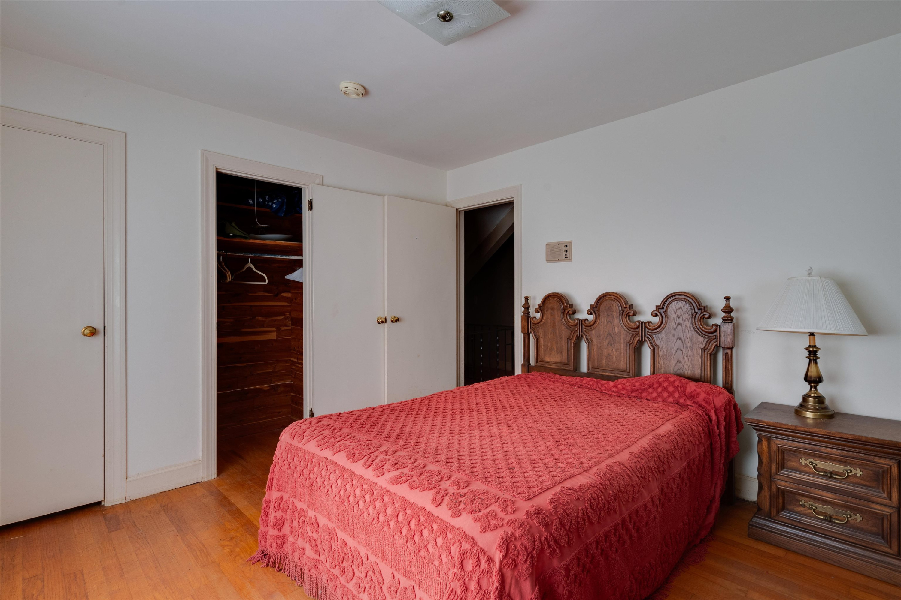 7676 Webbs Mill Road Spring Hope, NC 27882 - Photo 8 of 10 a bed room with a bed and a closet