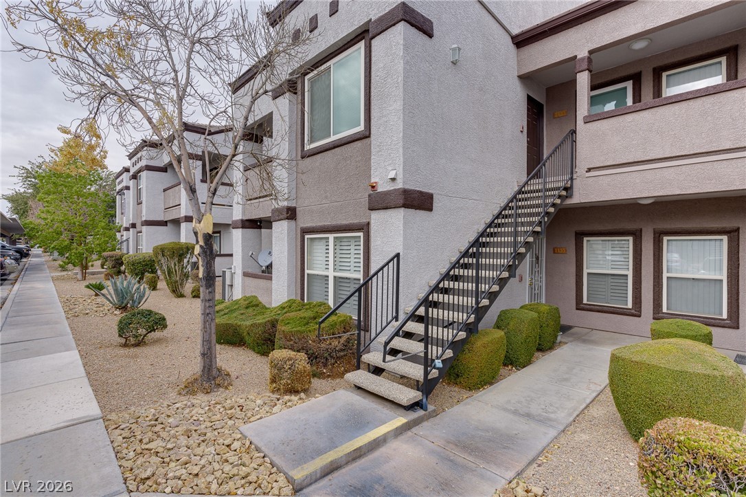 7255 West Sunset Road, Unit 2155 Las Vegas, NV 89113 - Photo 5 of 21 View of building exterior featuring stairway