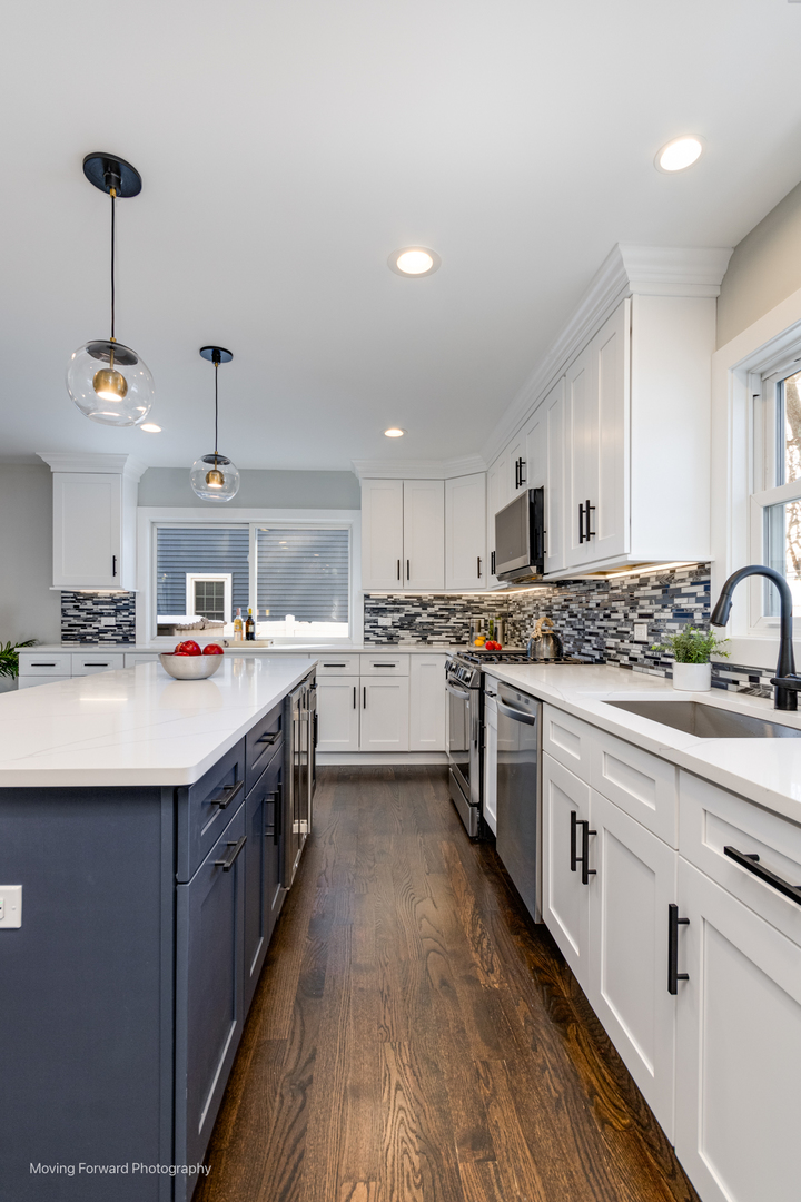 192 North Lambert Road Glen Ellyn, IL 60137 - Photo 8 of 48 a kitchen with kitchen island granite countertop a sink a counter top space stainless steel appliances and cabinets