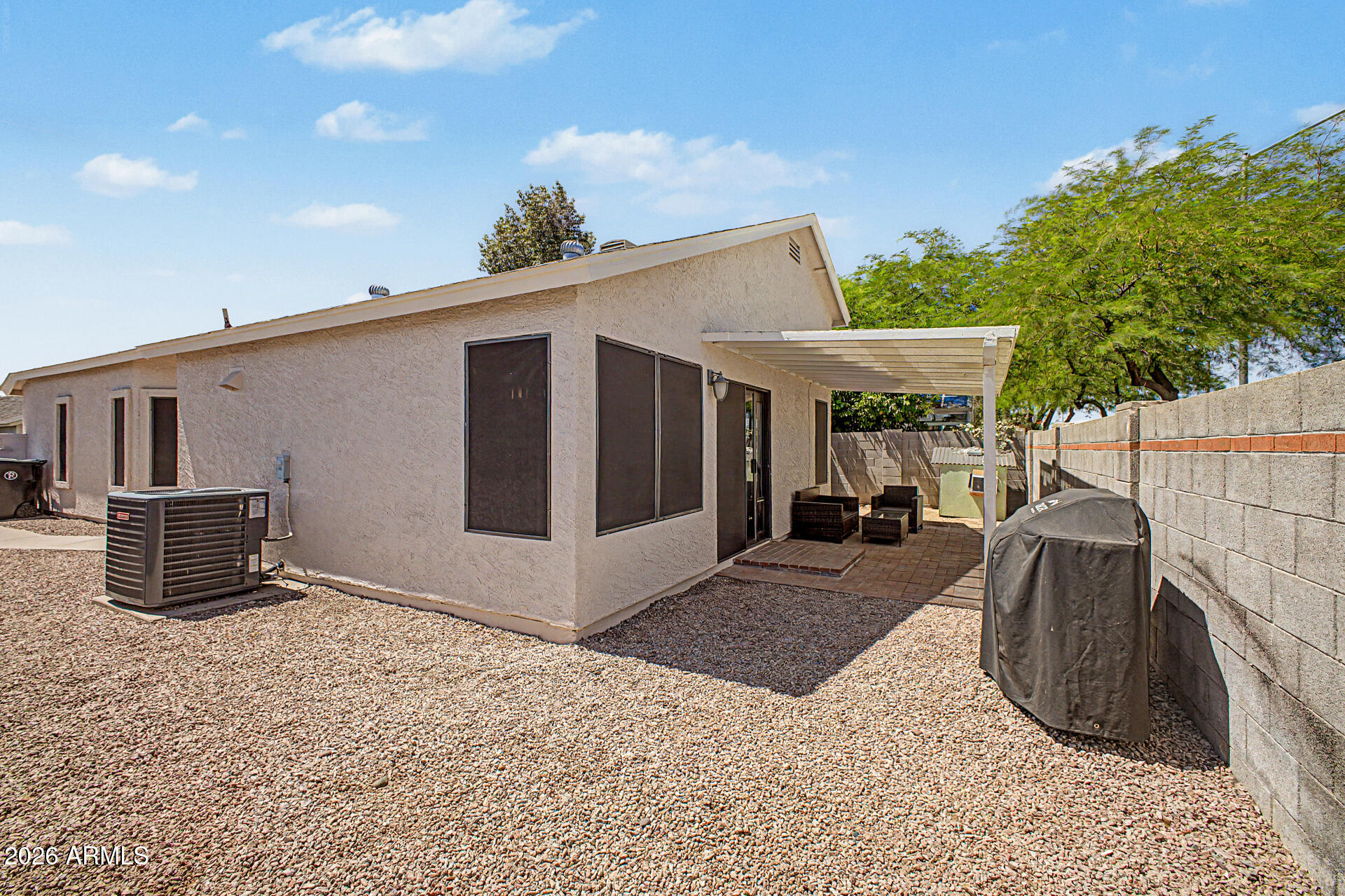 4725 East Brown Road, Unit 70 Mesa, AZ 85205 - Photo 25 of 25 a view of a house with backyard and sitting area