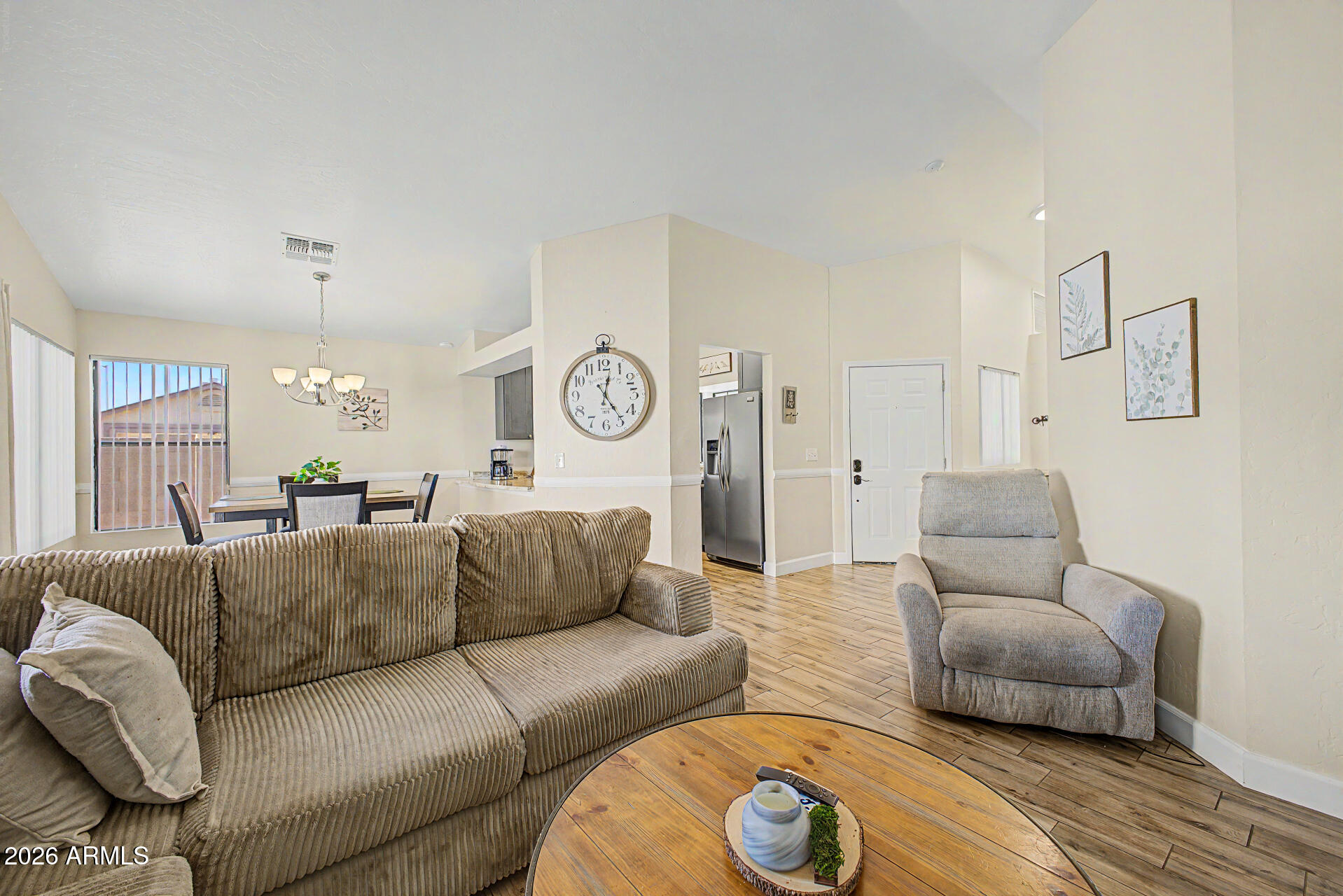 4725 East Brown Road, Unit 70 Mesa, AZ 85205 - Photo 6 of 25 a living room with furniture and a wooden floor