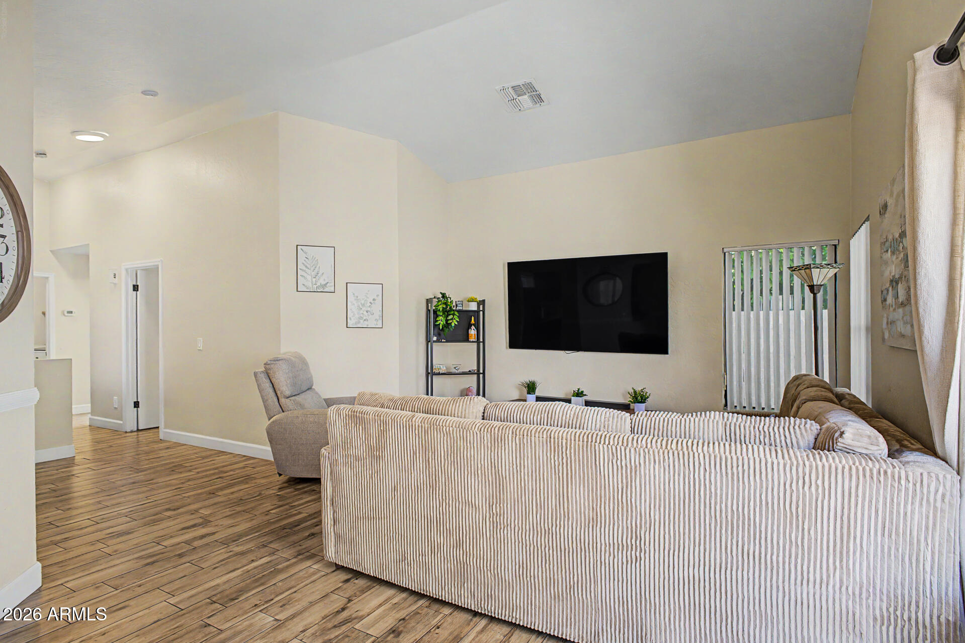 4725 East Brown Road, Unit 70 Mesa, AZ 85205 - Photo 7 of 25 a living room with furniture and a flat screen tv